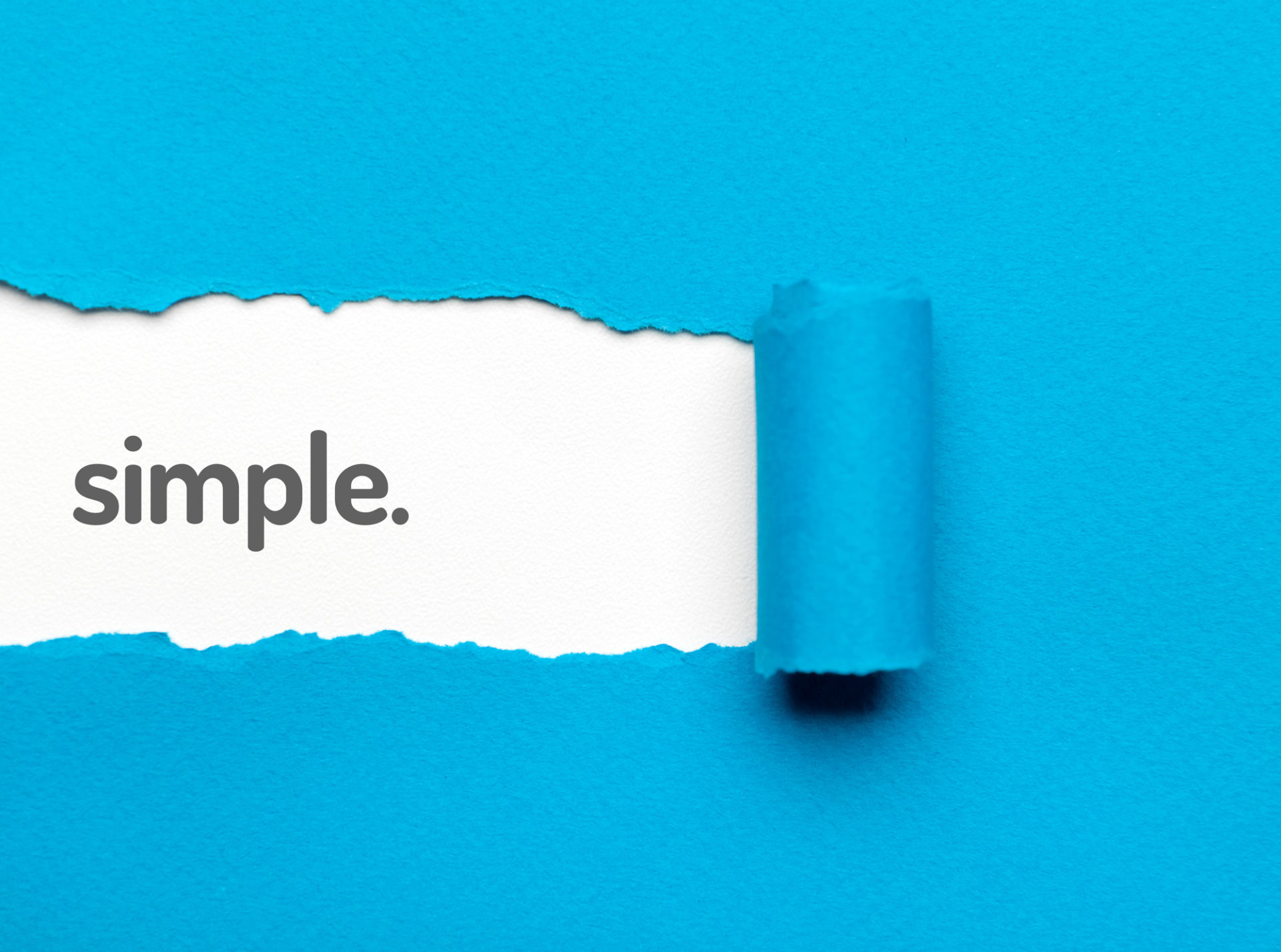 Blue paper tears away in a strip to reveal the word "simple"