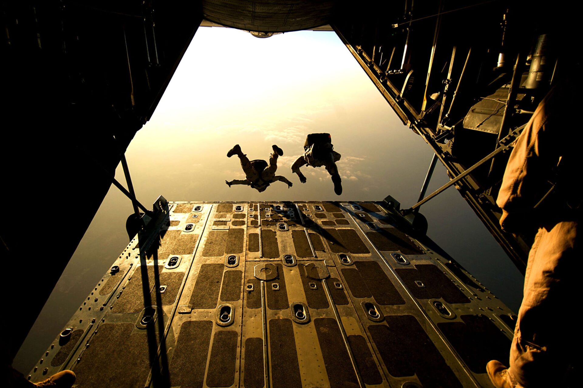 Skydivers exiting plane via rear ramp (Photo by Pixabay from Pexels)