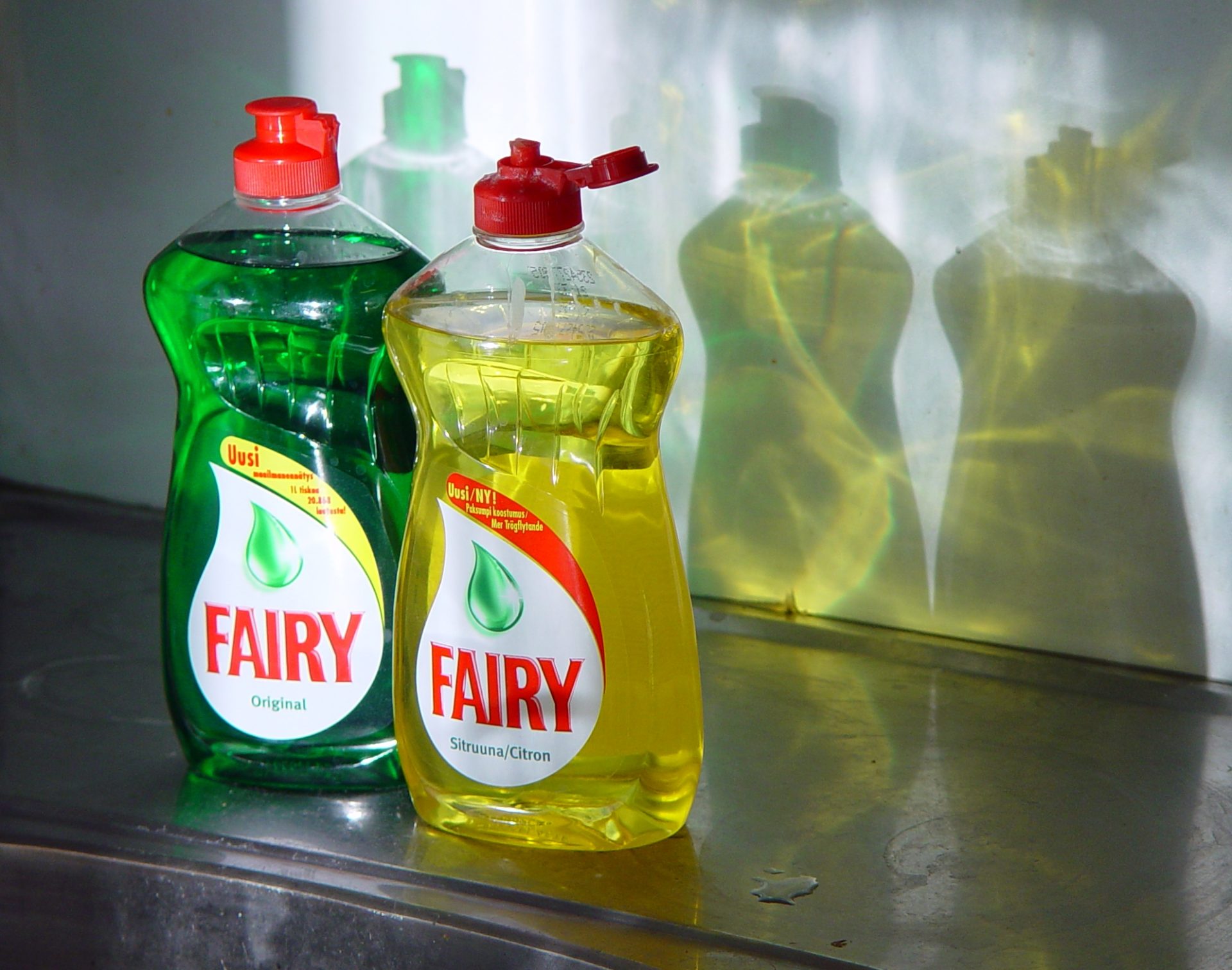 Two bottles of Fairy brand washing-up liquid