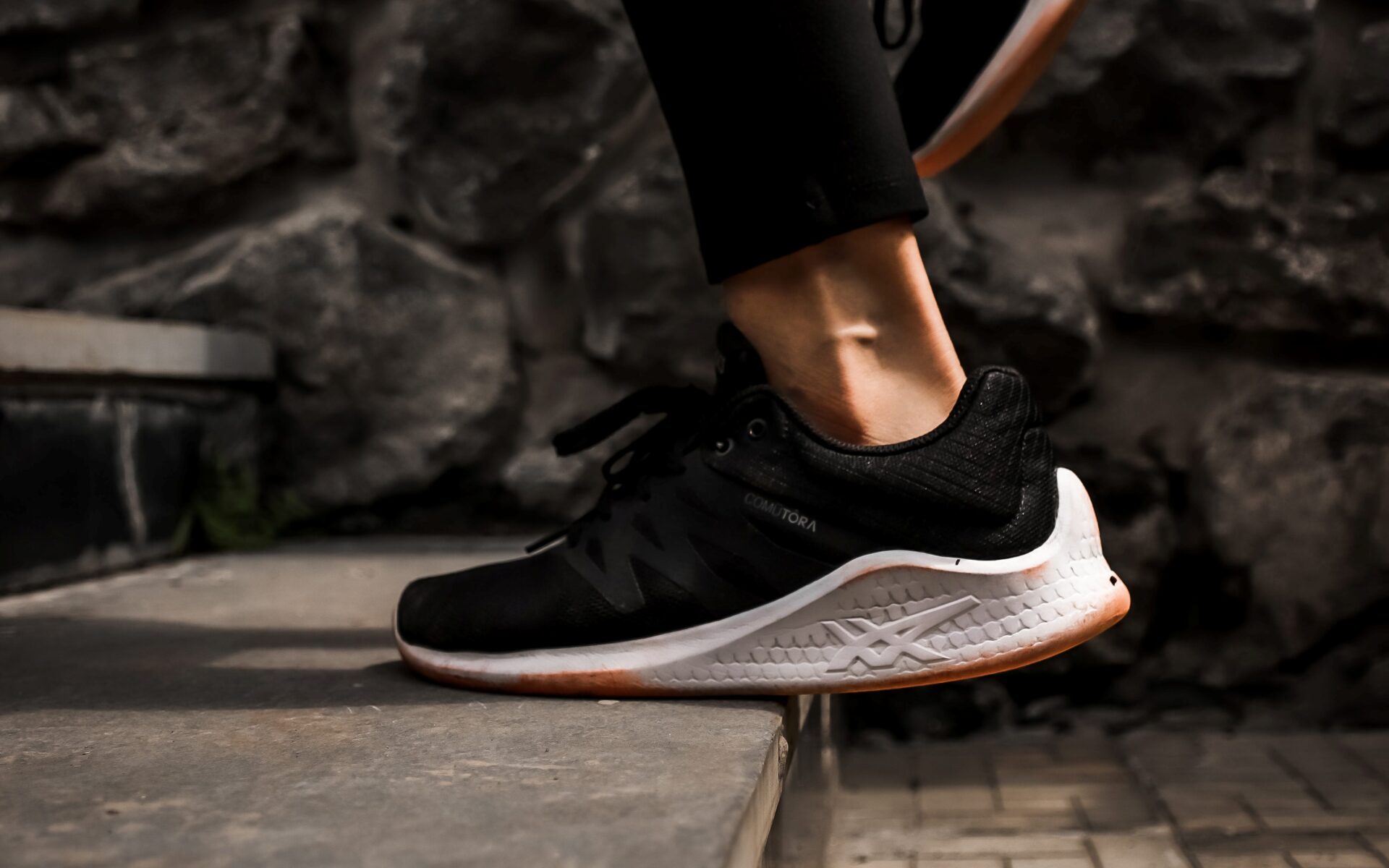 Close-up of a runner's legs and feet as they run up steps (Photo by Maddy Freddie from Pexels)
