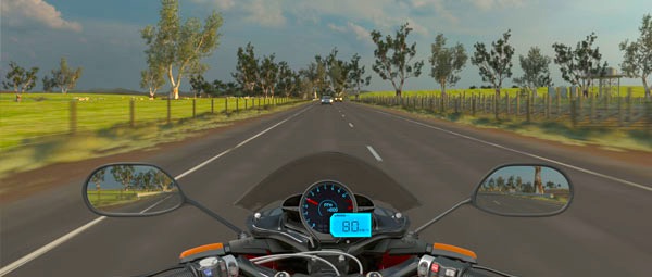 Riding a motorcycle on a road from perspective of rider