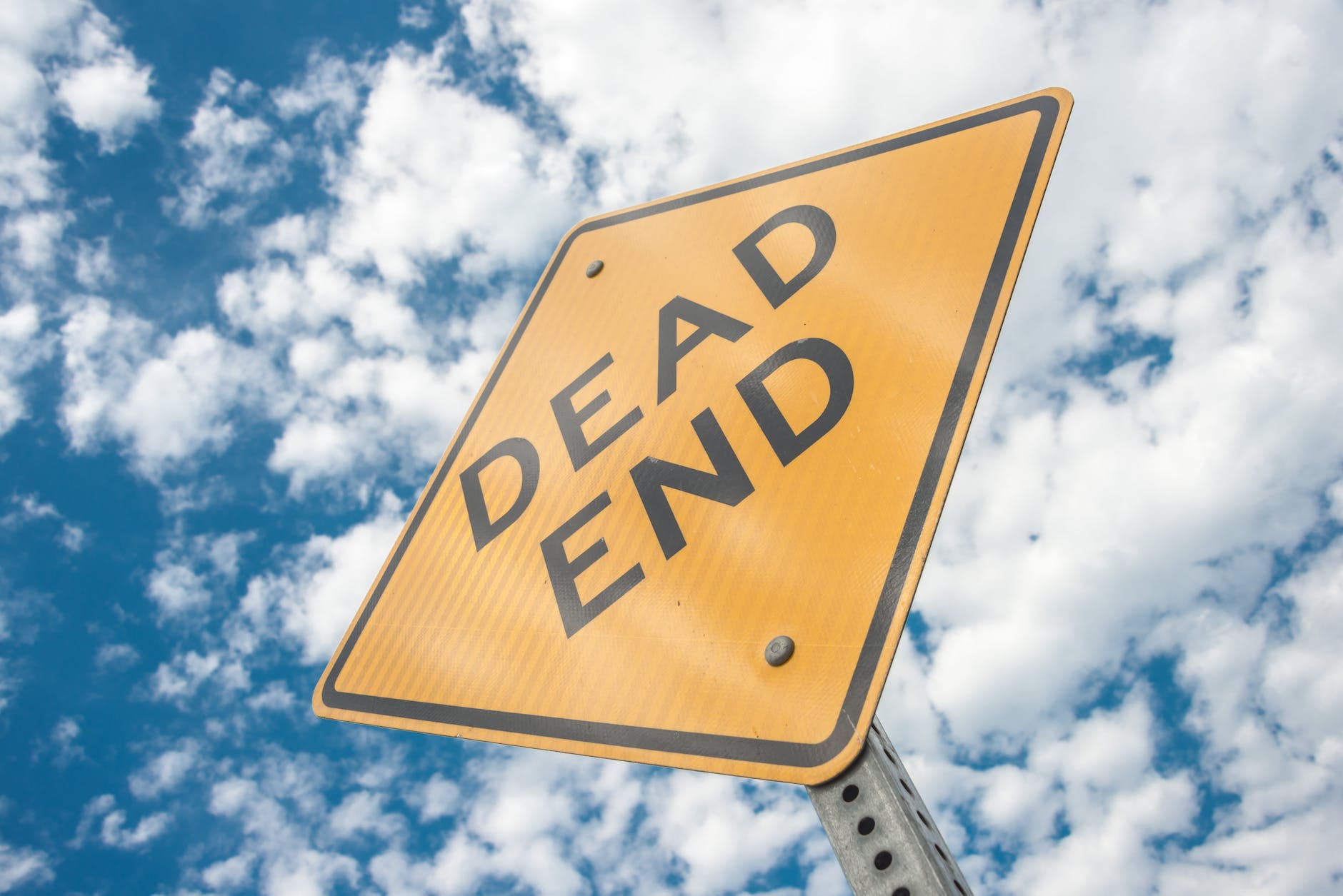 Yellow dead end sign during day time