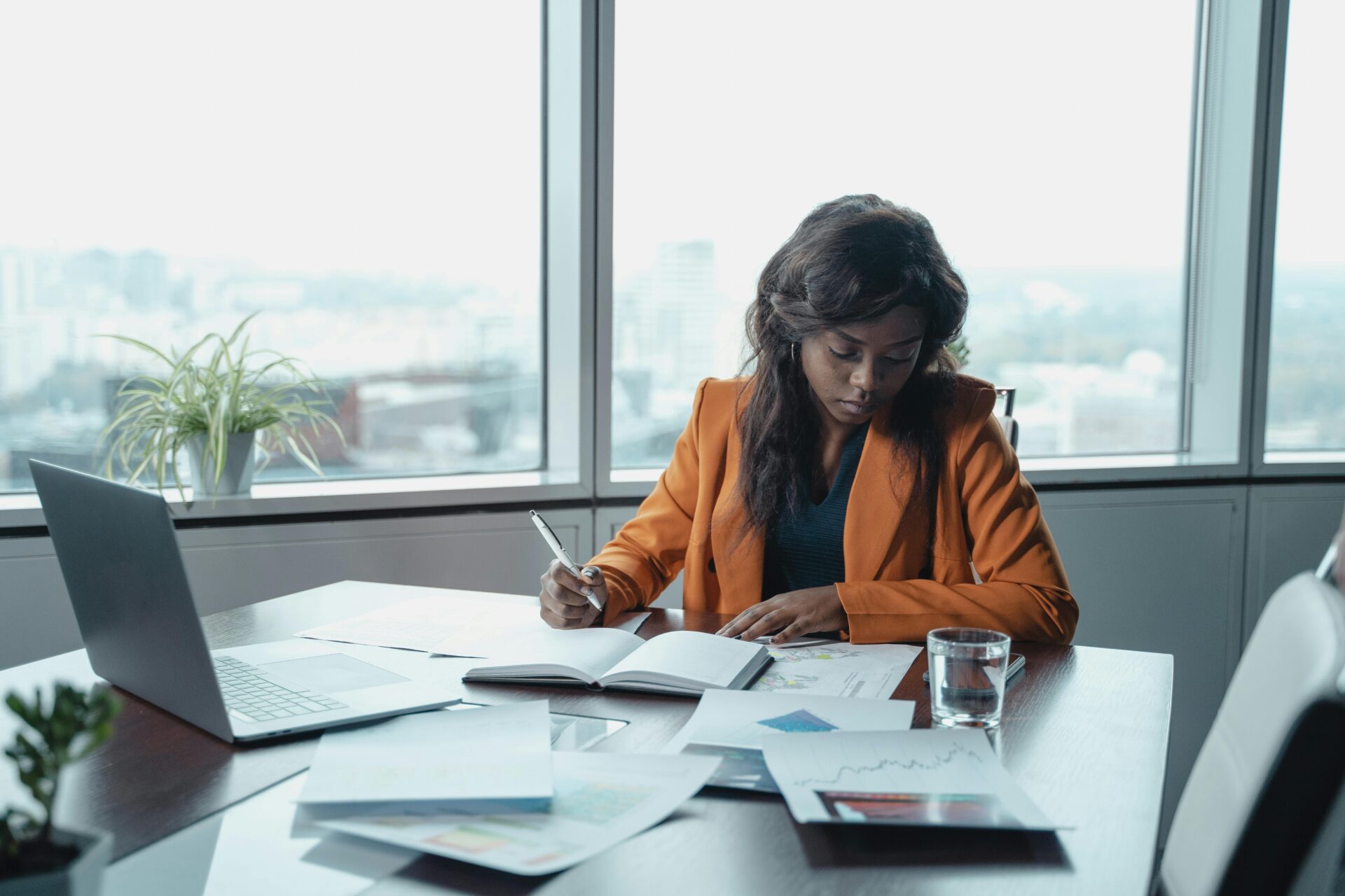 Woman working at desk in office (Photo by Tima Miroshnichenko at Pexels.com)